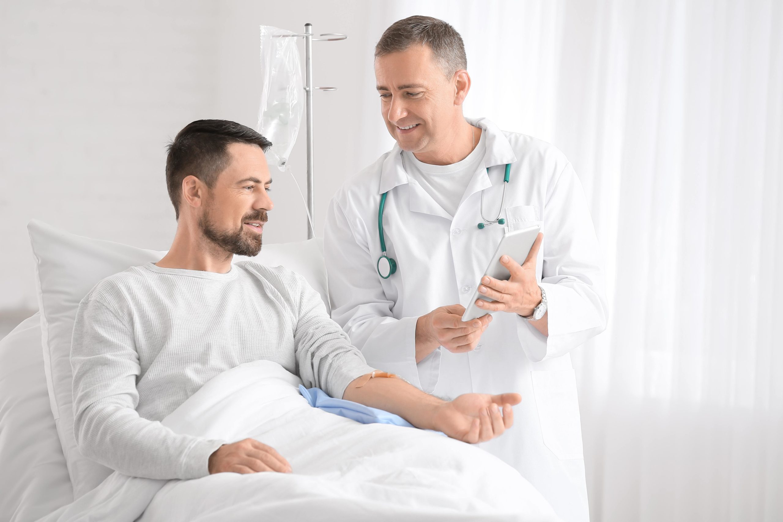 Happy doctor and patient in hospital ward | APEX Performance & Aesthetics in Sandy, UT